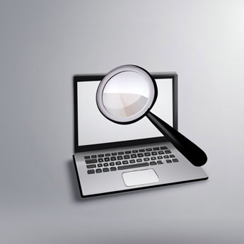 Magnifying Glass Focusing on Laptop